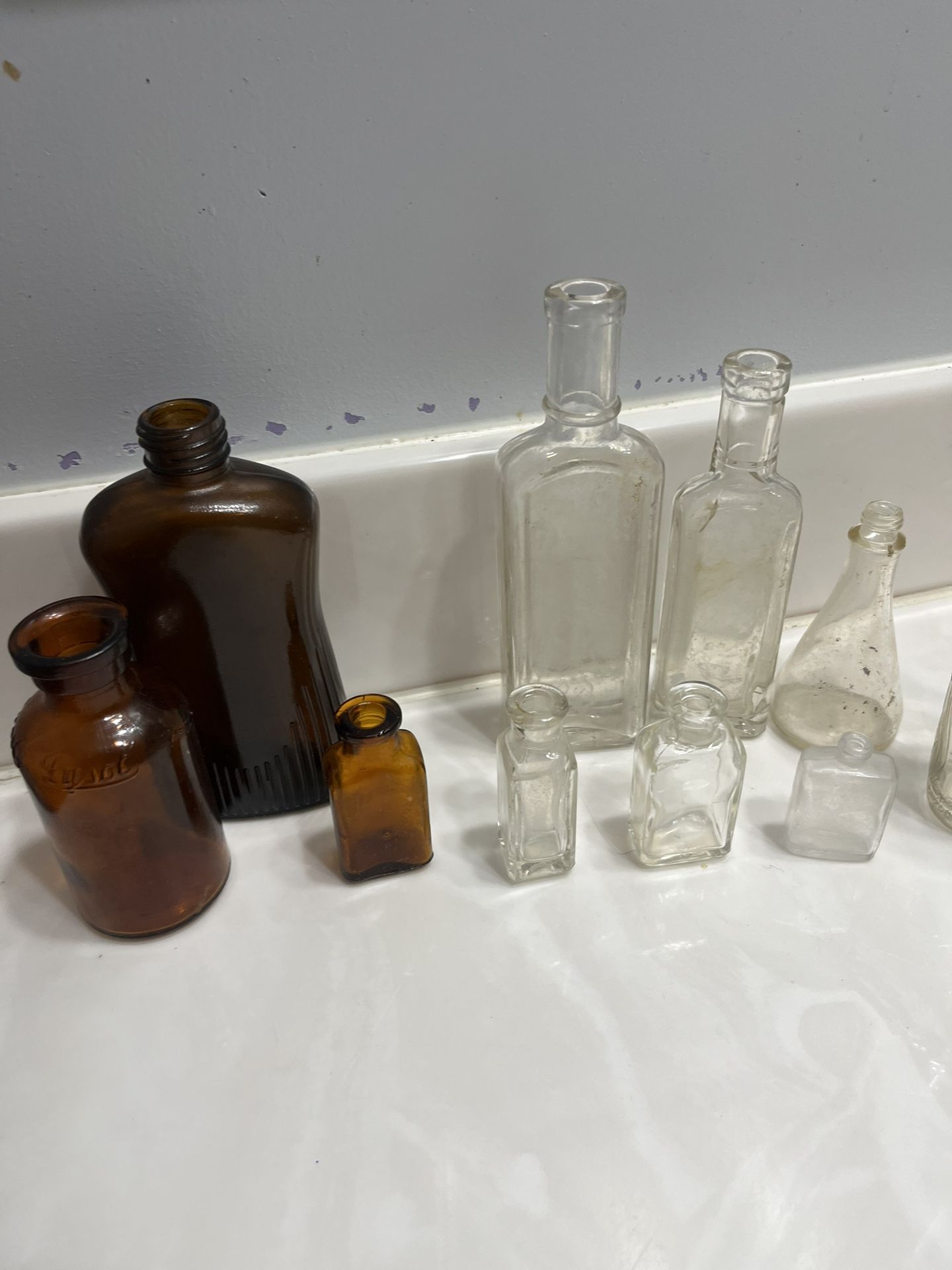 Variety Of Different Antique Bottles Etc