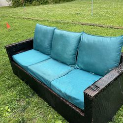 Brown wicker patio couch with