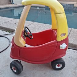 Little Tikes Cozy Coupe — a classic kids’ ride-on toy car.