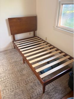 Twin wooden bed frame with mattress