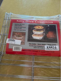 Brand new / still in original packing. Nifty Oven Companion!