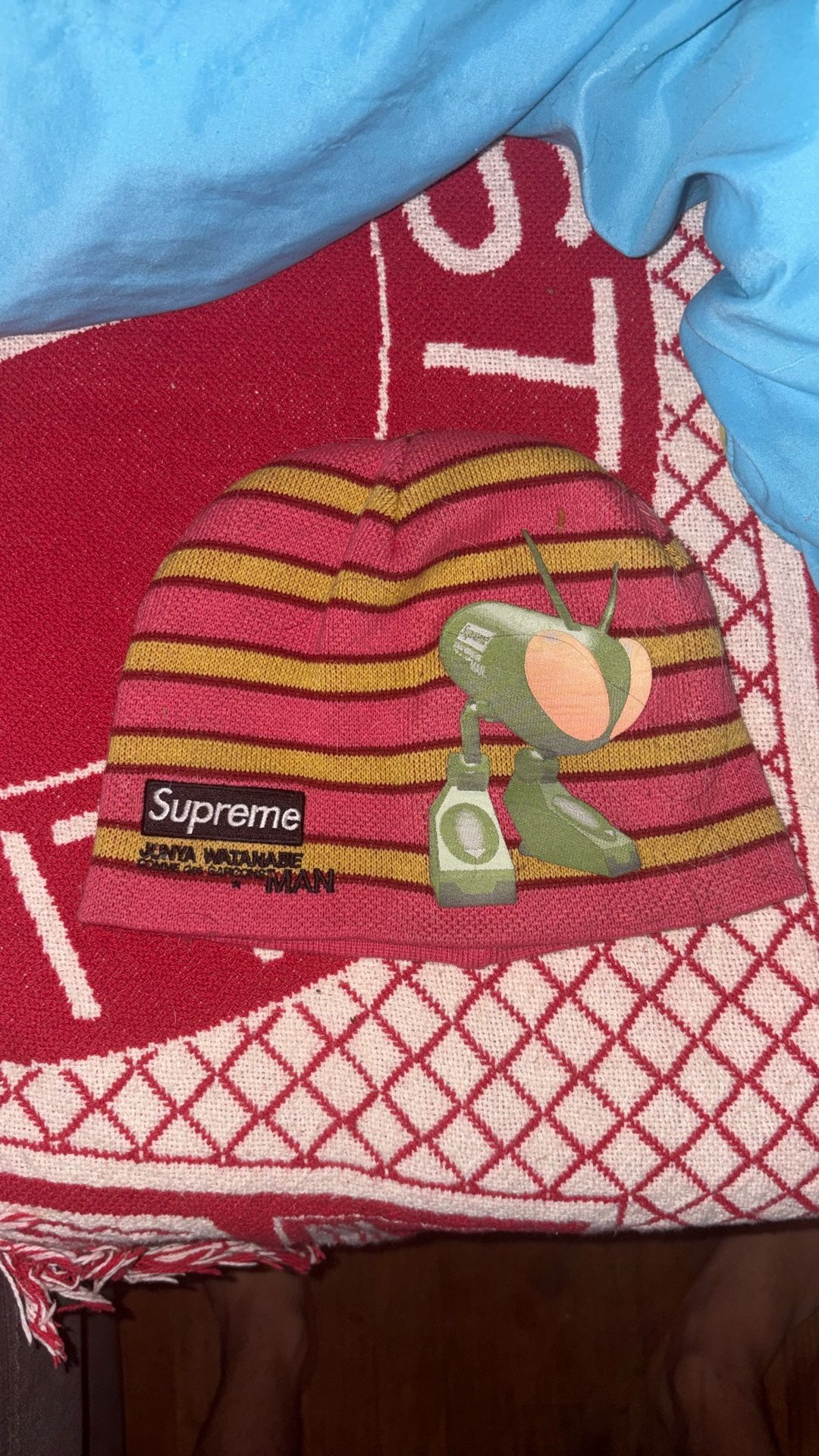 Supreme x Junya Watanabe Comme des Garçons MAN Beanie in the "Red Stripe" colorway