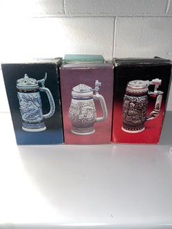 Handcrafted Avon beer steins