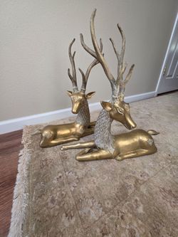 Vintage pair of Hollywood Regency-style brass reclining deer stag sculptures. Extra Large 20" x 20"