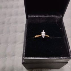 1/4 carrot marquis cut diamond ring. 10 carrot gold setting