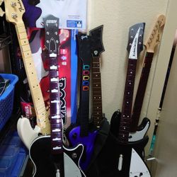 Assorted Rock Band And Guitar Hero Guitars