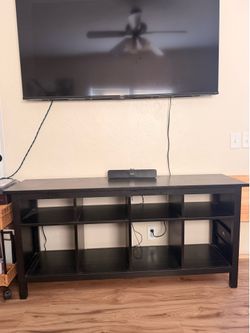 Entertainment center under TV