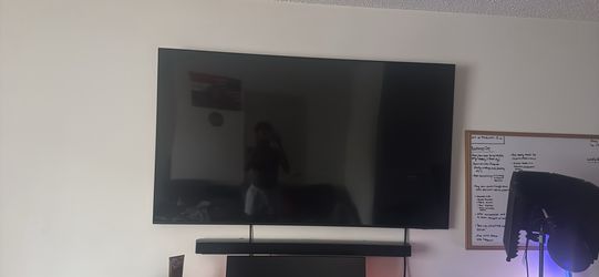 Smart samsung tv and speaker underneath