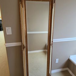 Full length beveled glass mirror with wood frame 
Can lean on the wall or hung up
24"w x 68"h