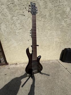 Schecter six string bass with case