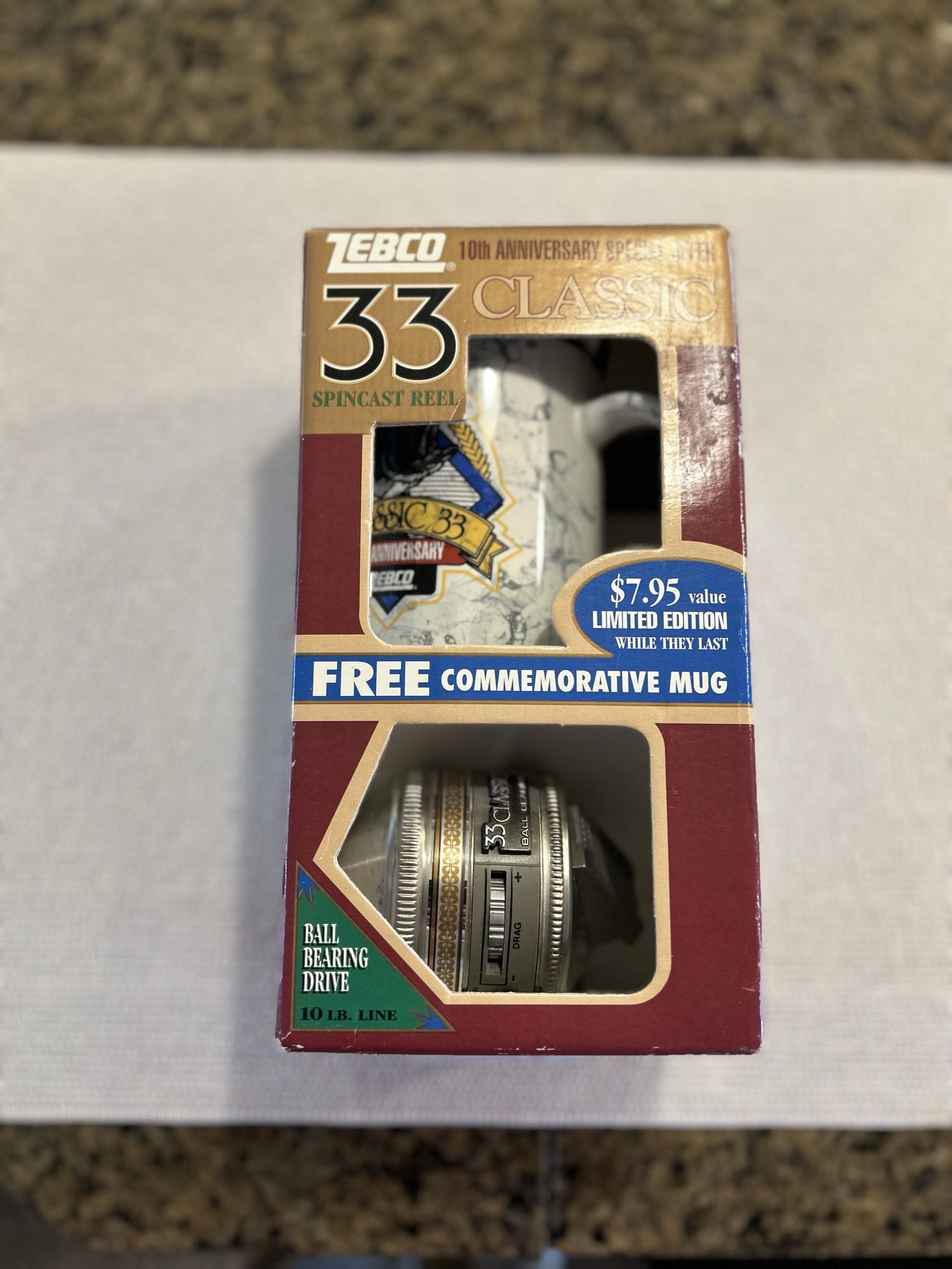 Collectible Zebco Reel And Mug.