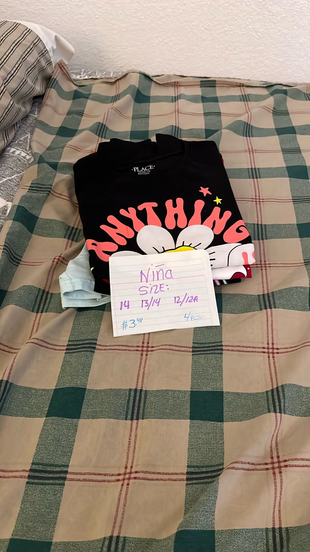 Girls' clothing. Sizes: 14. 13/14. 12/12A (shirts, shorts). $3 dlrs.