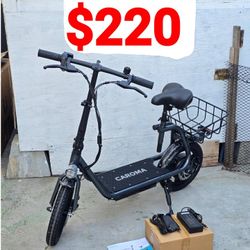 Caroma P2 Peak 800W Electric Scooter w/
500w brushless hub motor Seat, 14" Tire, Up to 25Miles & 20MPH Electric Scooter Adjustable E-Scooter w/ Basket
