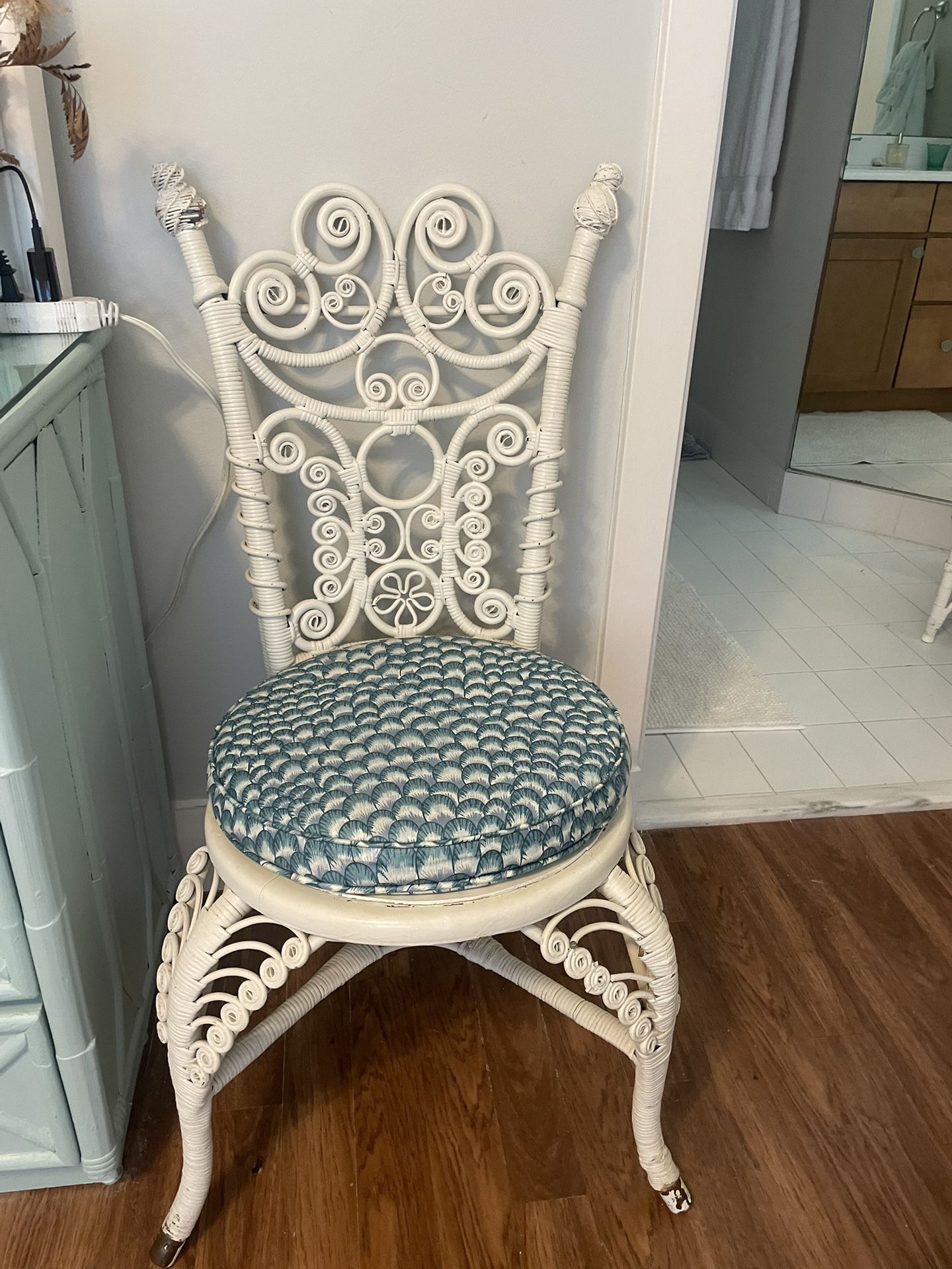 Beautiful White Wicker Chair With Blue Patterned Cushion