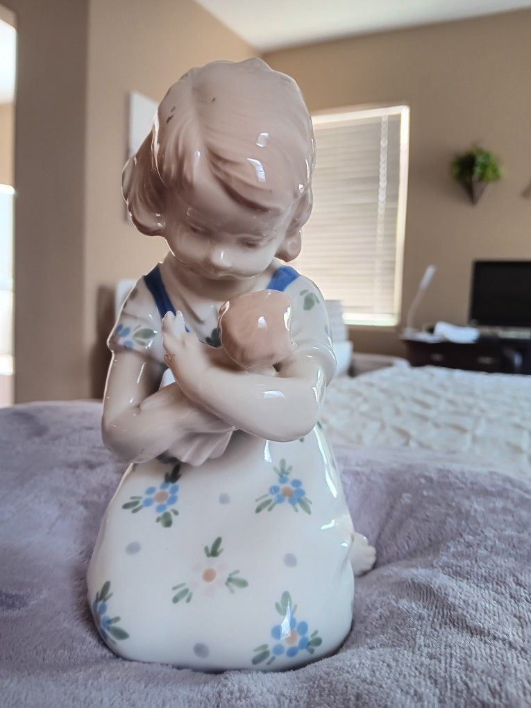 Girl Holding Doll