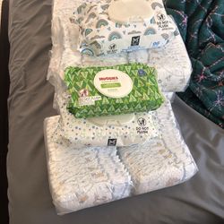 4 packs of huggies diapers and wipes 