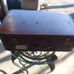 Antique suitcase. Make a beautiful table out of it.