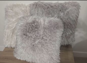 3 pillows 2 gray and one white w/ silver