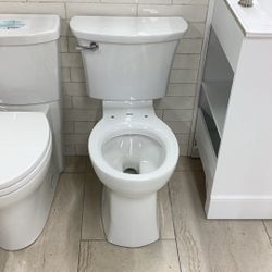 Round Toilet, American Standard no seat, Two Pieces Left Lever Available For Pick Up