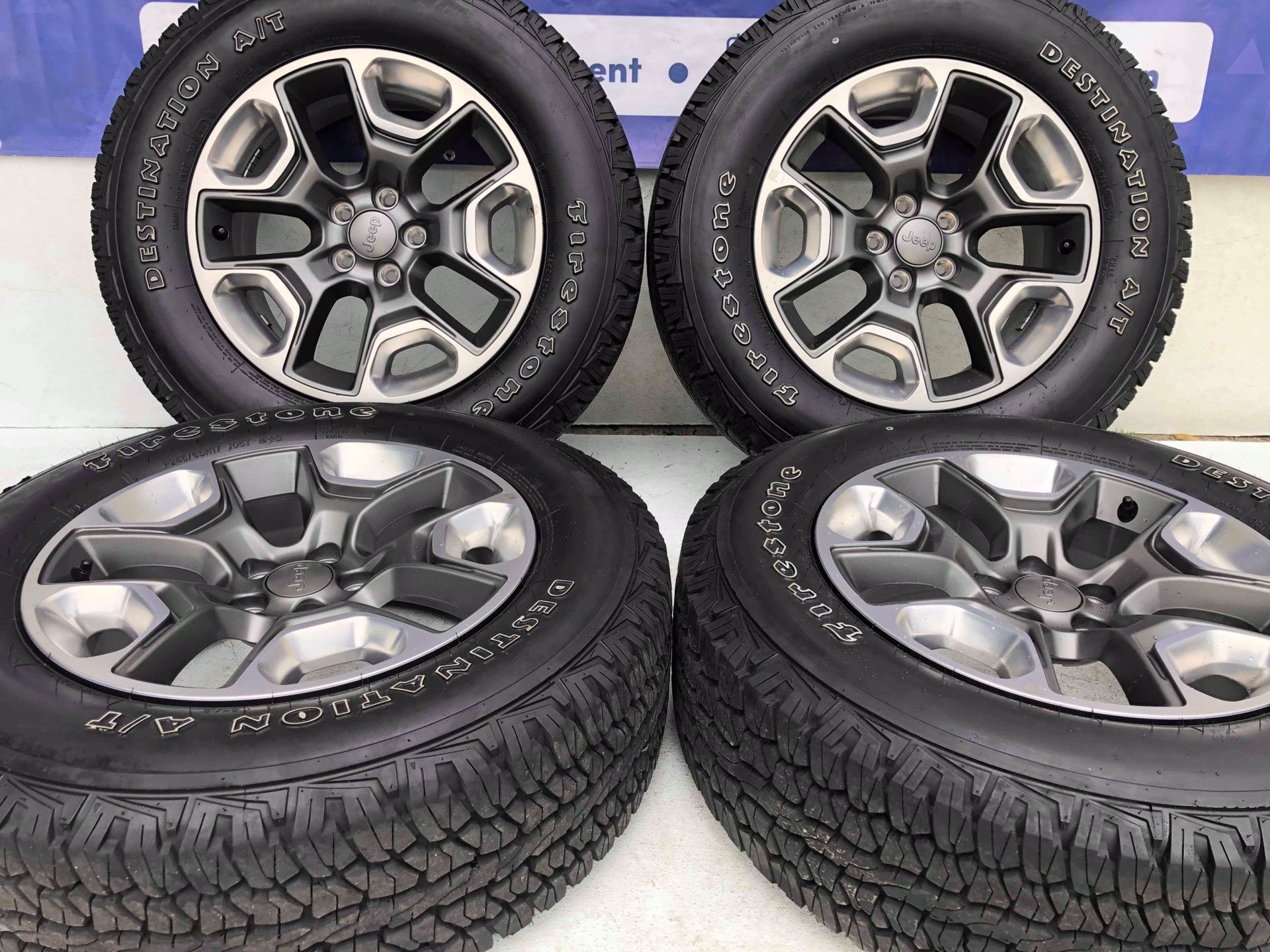 17” Jeep Compass wheels and tires like new 245-65-R17 Firestone take off Ask for jennifer