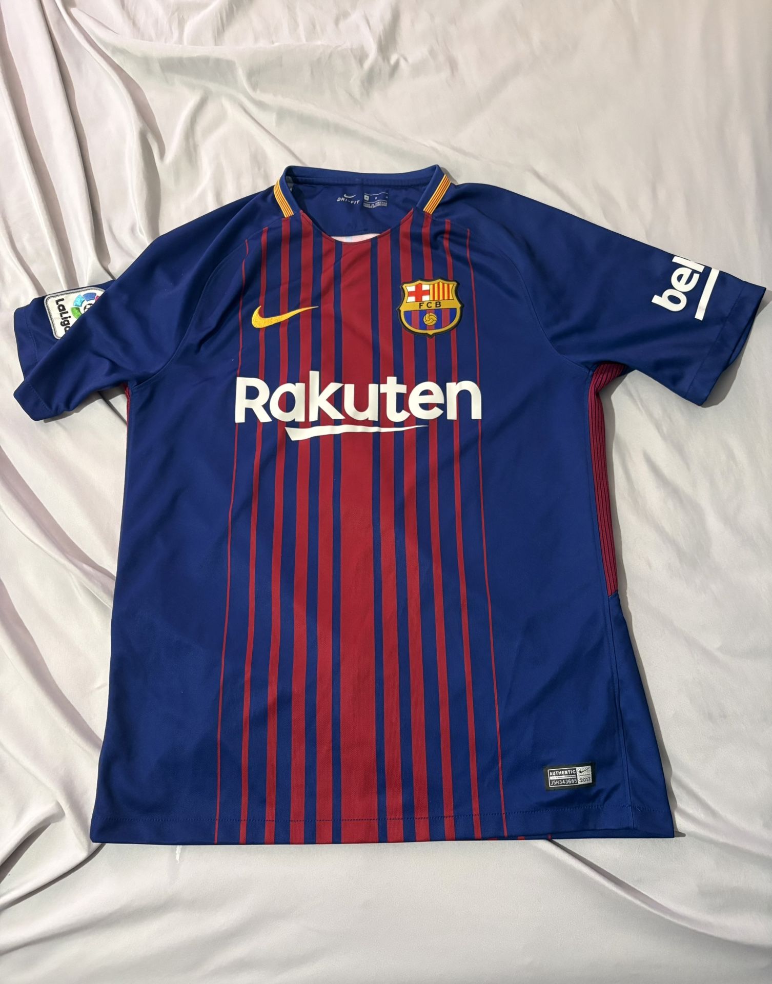 This is a Nike FC Barcelona 2017/18 home jersey with Lionel Messi's name and number 10 on the back