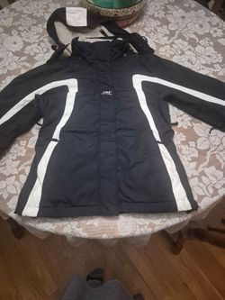 Womans black Helly Hansen waterproof coat, size small