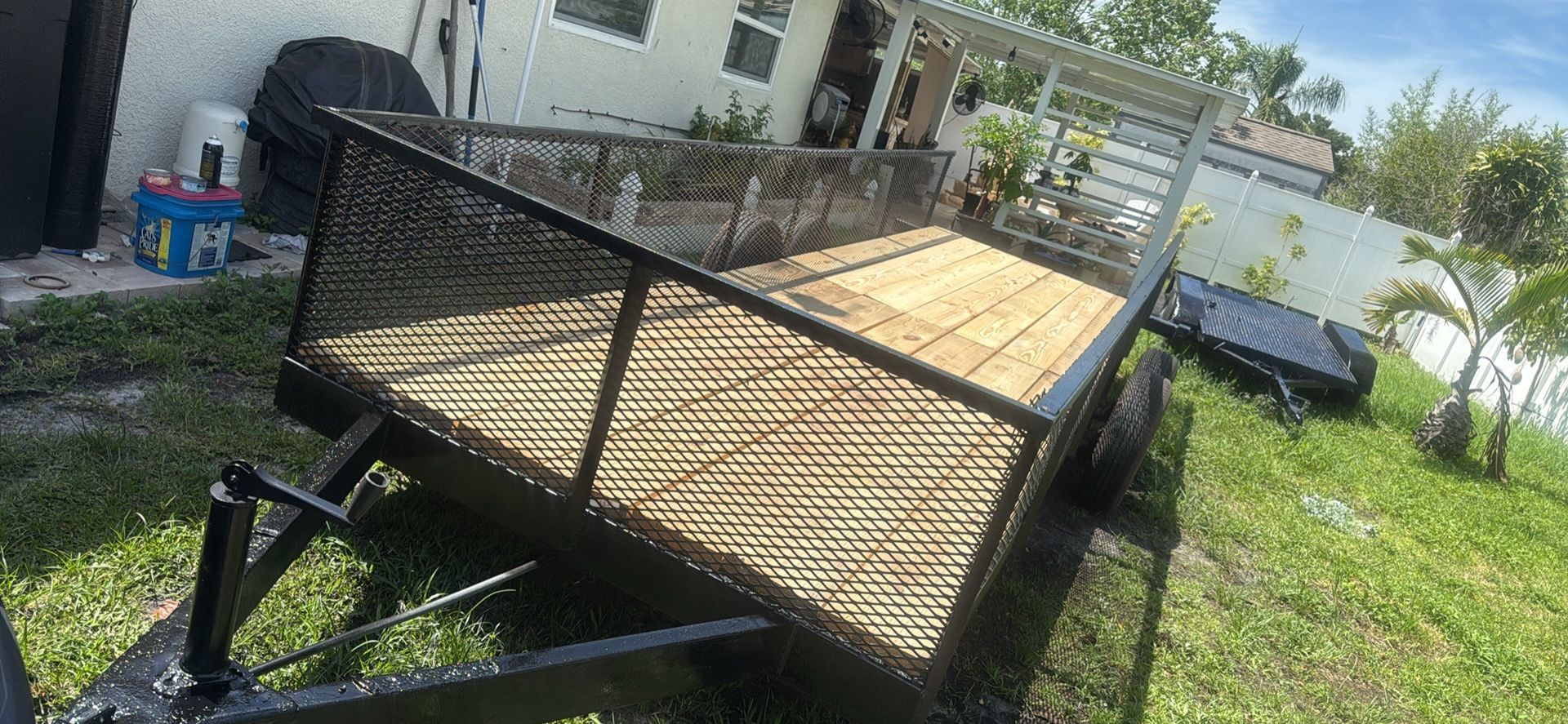 21' x 5 1/2' steel trailer dual axle with new wood new lights new bearings new tires