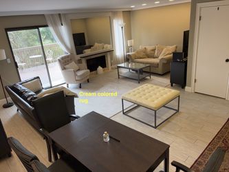 Cream colored rug (rectangular shaped)
