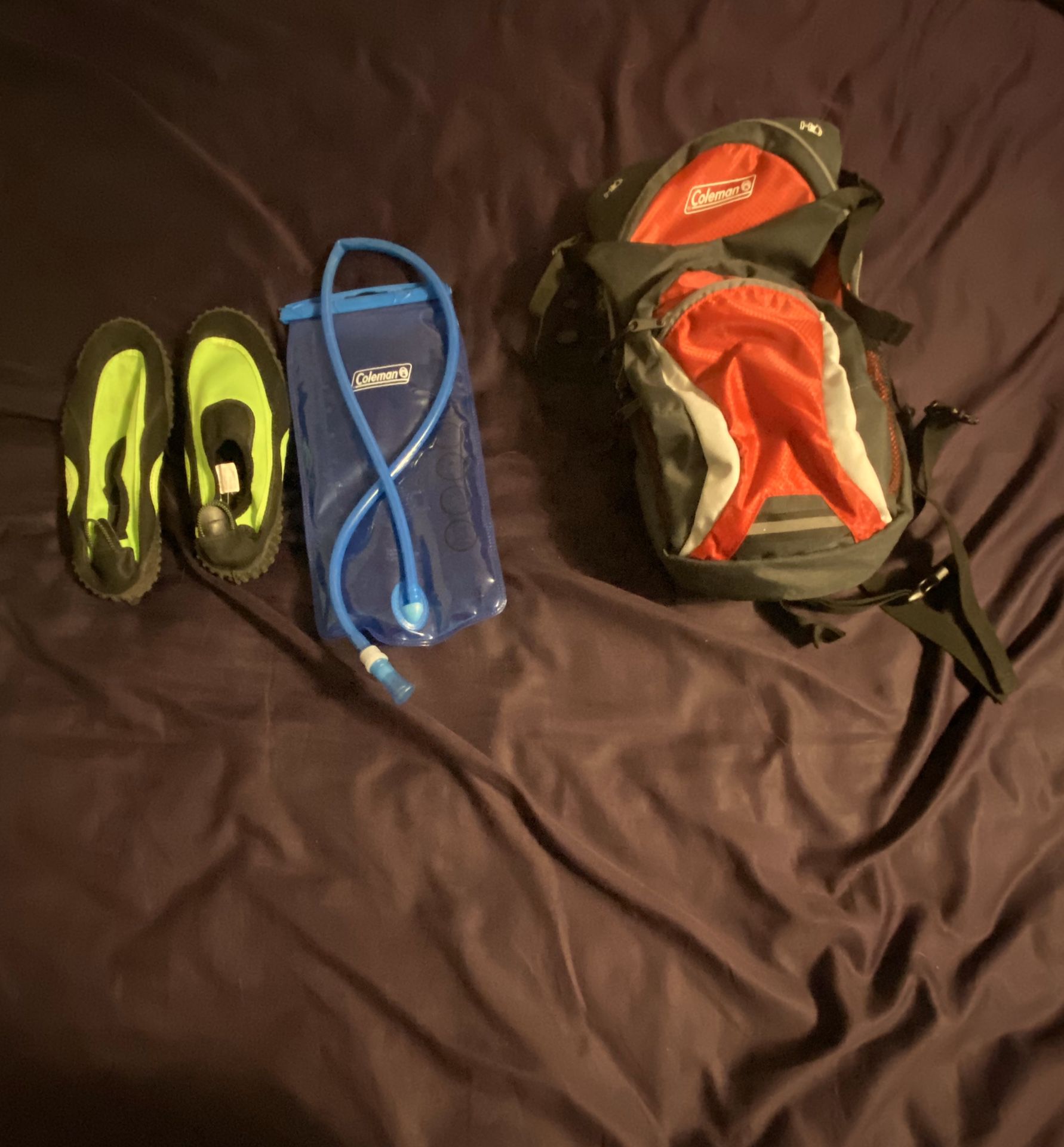 Hiking backpack with liquid pouch and water shoes