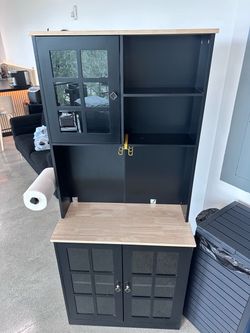 Black Cabinet with Glass Doors and Open Shelving