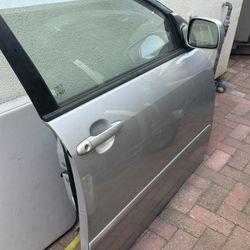 03-08 Toyota Corolla front passenger side door complete