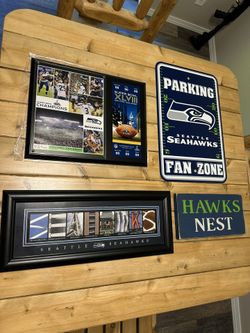* 4x Seattle Seahawks Memorabilia pieces! Super Bowl plaque, Seahawks picture frame, Hawks block, and a Seahawks Parking sign. These are big pieces 