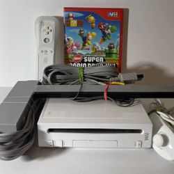 NINTENDO WII with Super Mario Bros. Game