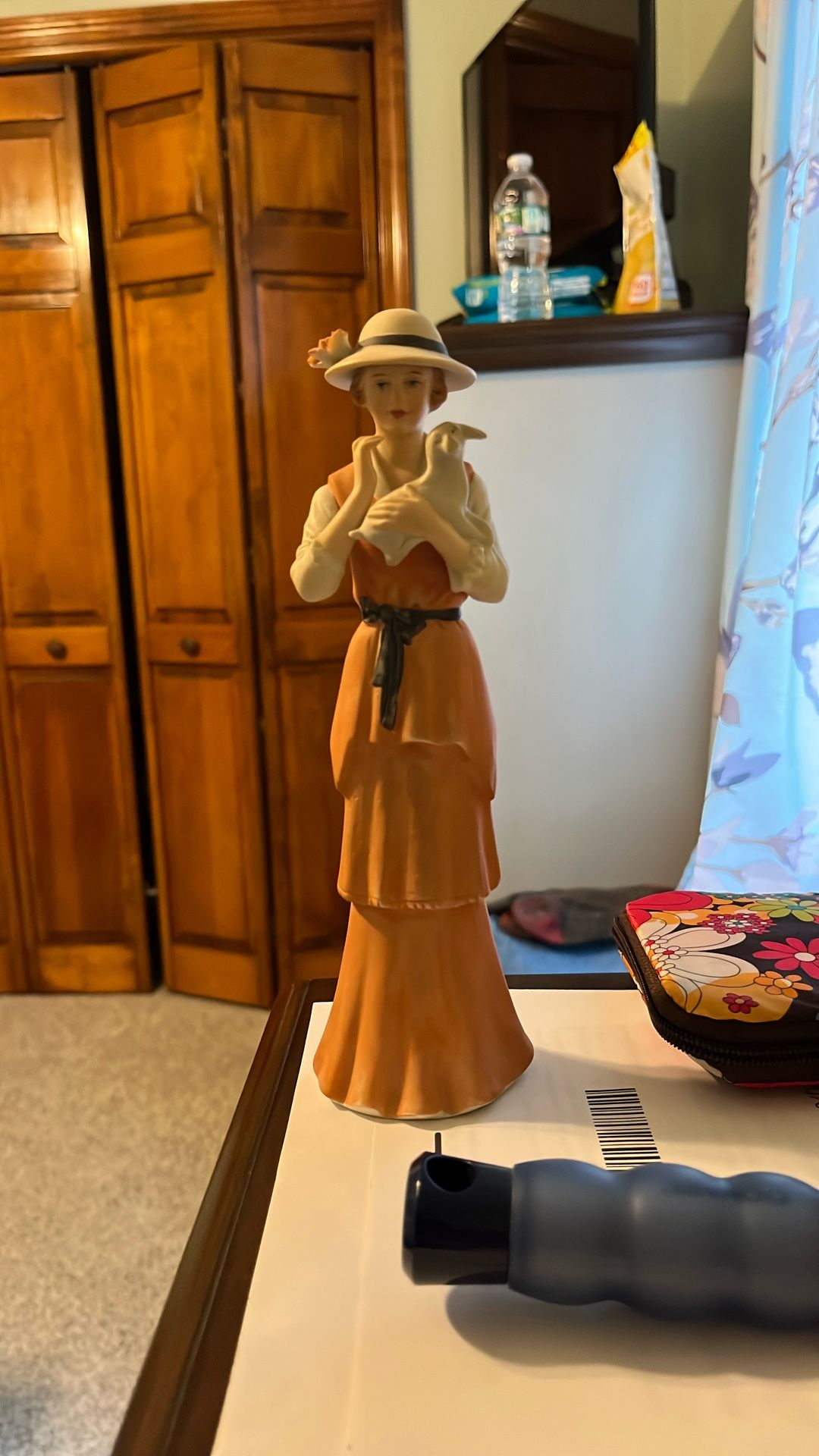 Girl Holding lamb Figurine