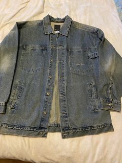 Denim jacket for men.  One button is loose.