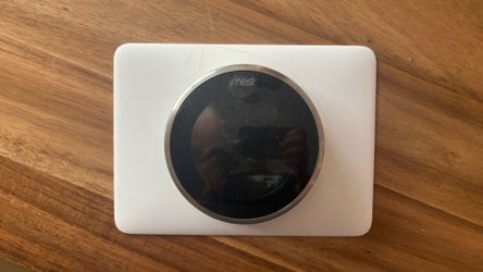 Nest thermostat with base and wall cover