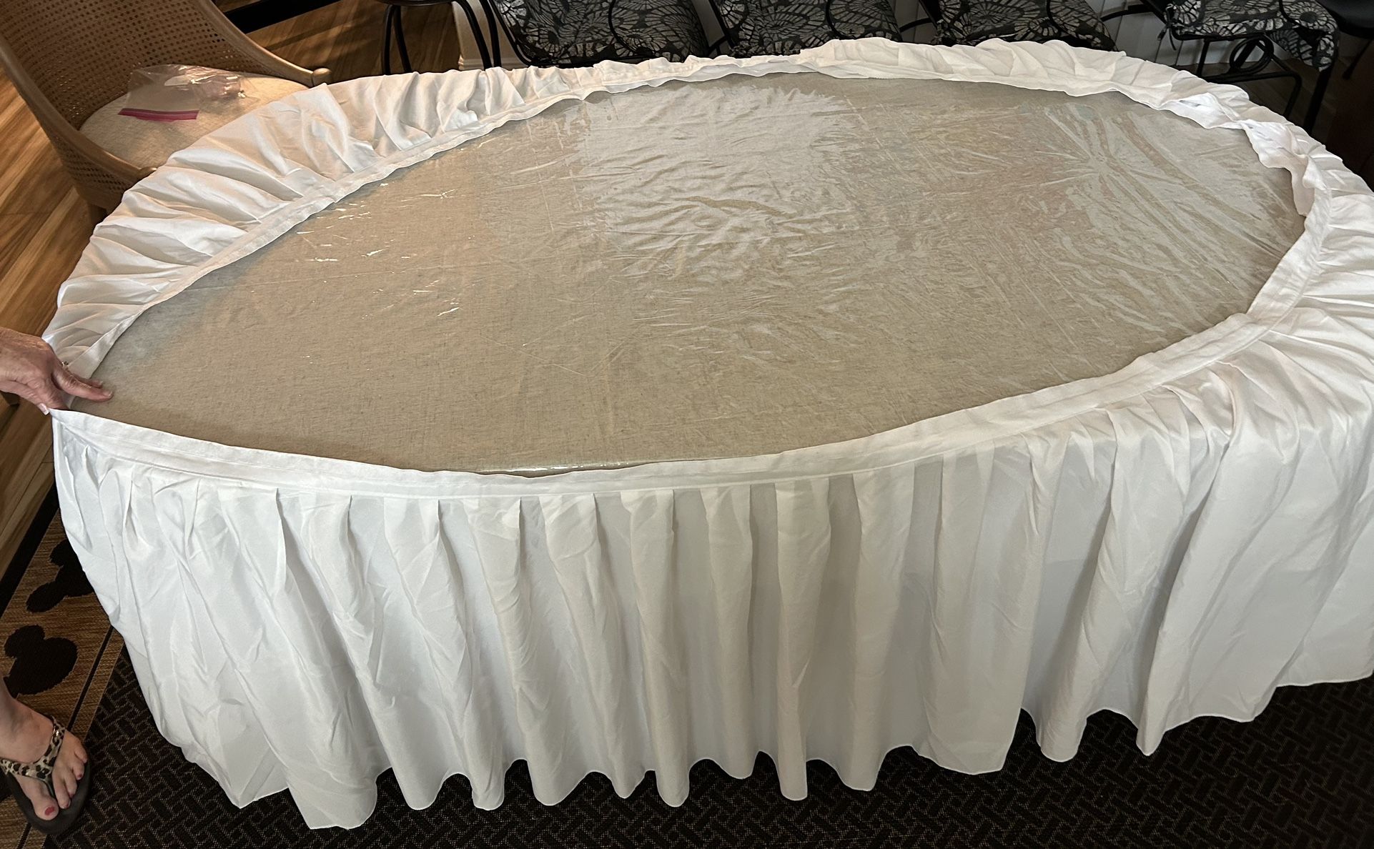 GENTLY USED WHITE TABLE SKIRT approximately 21’ (un-stretched) with 12 clips