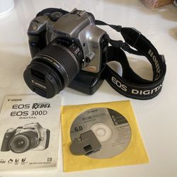 Canon Digital Rebel DSLR w/18-55mm Image Stabilized Lens, Grip, And Bag
