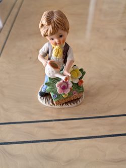VINTAGE CERAMIC BOY WATERING FLOWERS