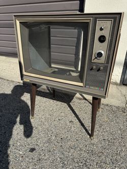 Vintage television, mid-century modern with legs standing television completely gutted for production purposes size is 26” x 19” x 34”  screen size is