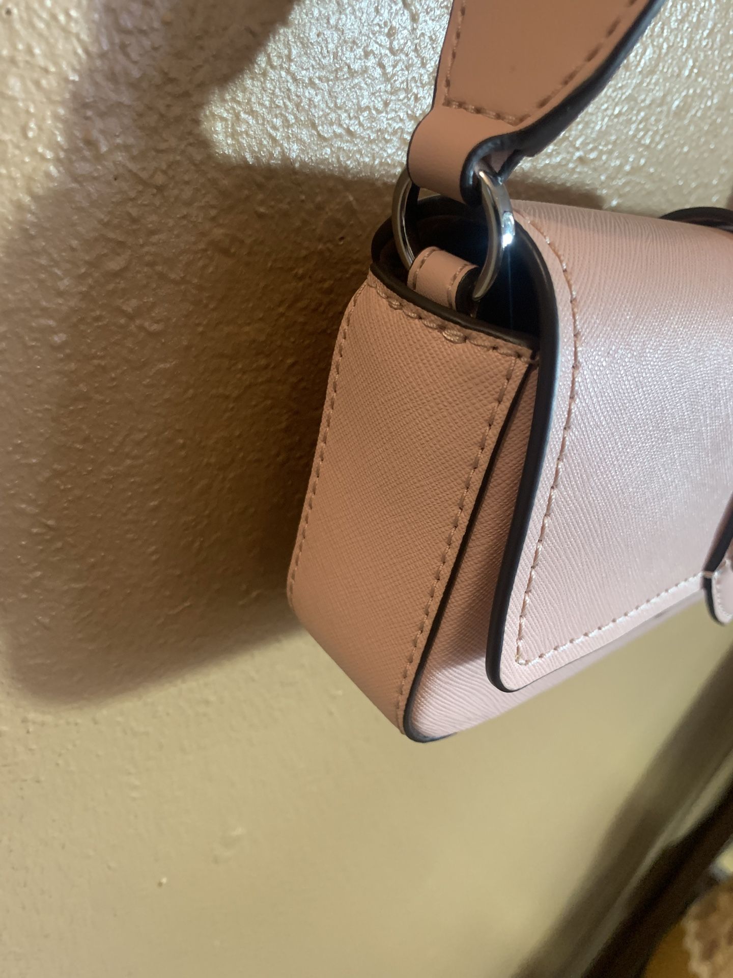 mk pink sling bag
