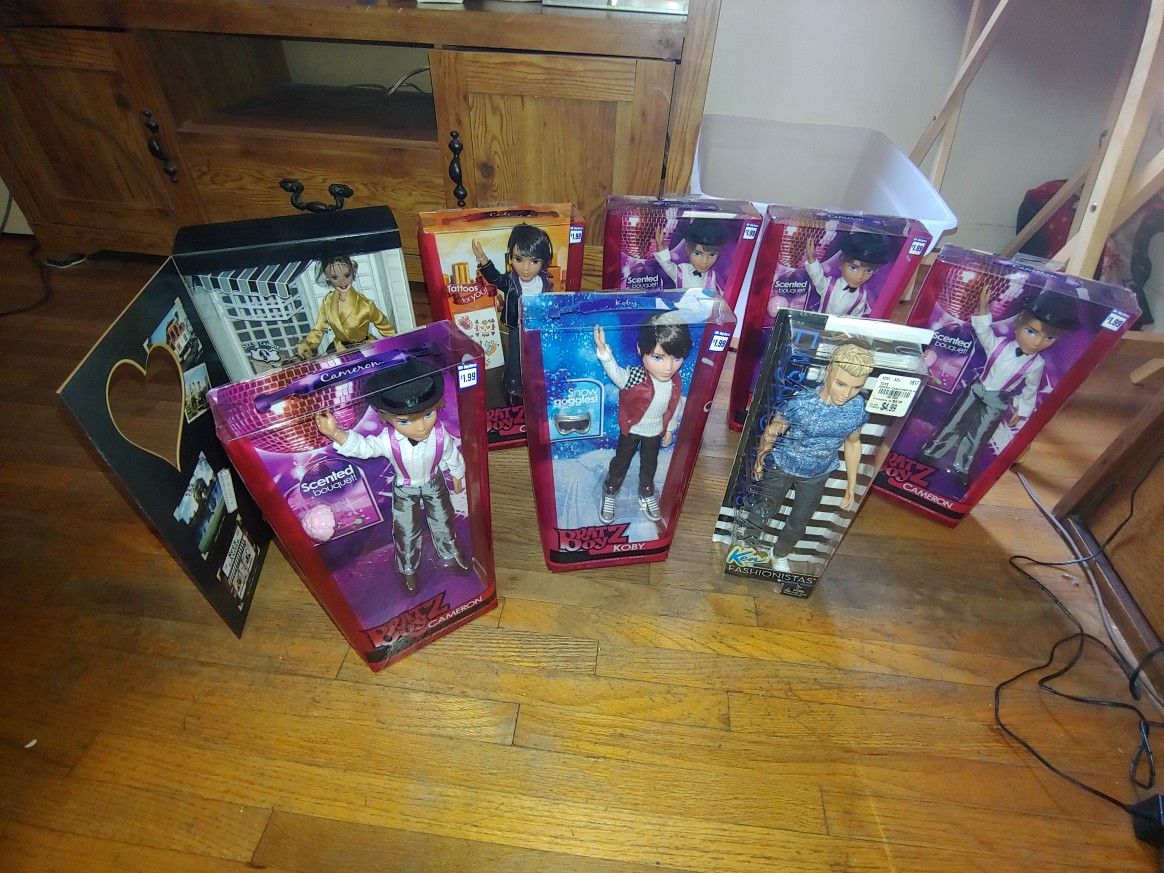 Bratz And A Barbie Doll