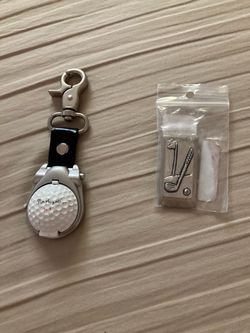 Golf-style linked watch . Includes time and compass and one design golf clip it make in Canada