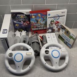 NINTENDO WII Bundle + Mario Kart,WII Sports,Mario Galaxy,New Super Mario Bros. 2 Remotes + 2 Wheels