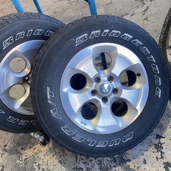 5 Jeep Wheels And Tires Including One New Tire On Spare