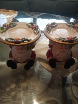 2 decorative Santa Claus candle holders