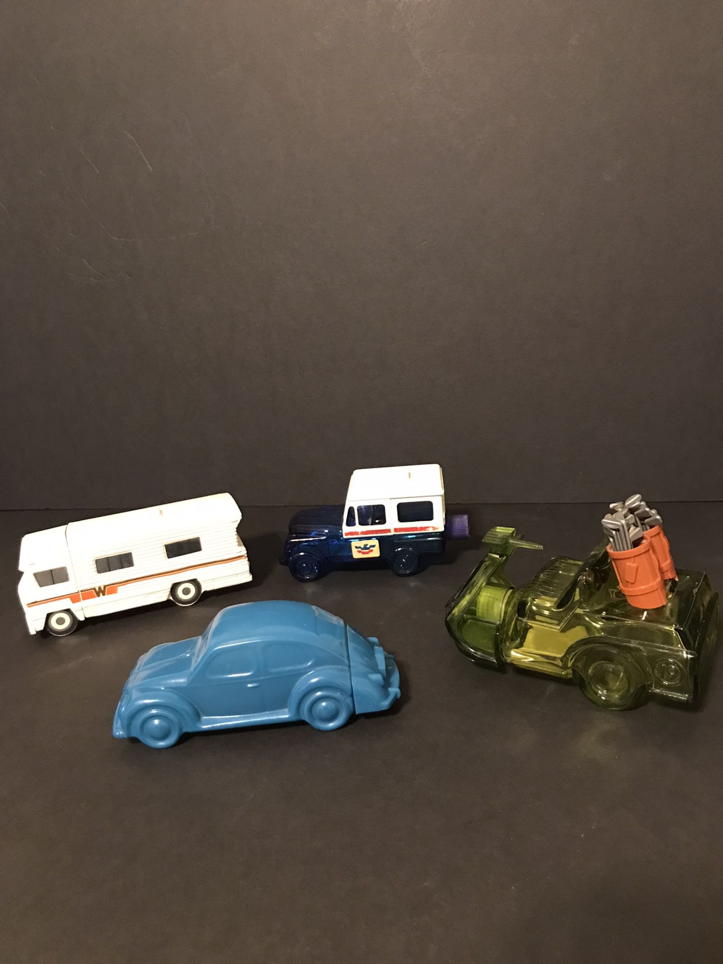 Set of 4 Vintage Avon Vehicles- VW Bug, Winnebago RV, Mail Truck, & Golf Cart