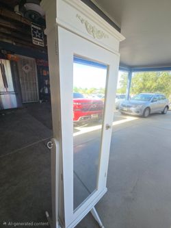 Free standing jewelry armoire with velvet interior