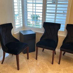 Four Black Dining Chairs.