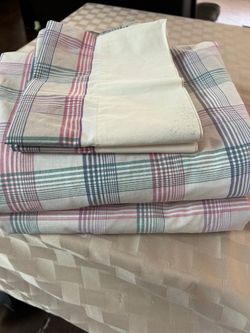 One pair of queen size sheets w/two matching pillow cases